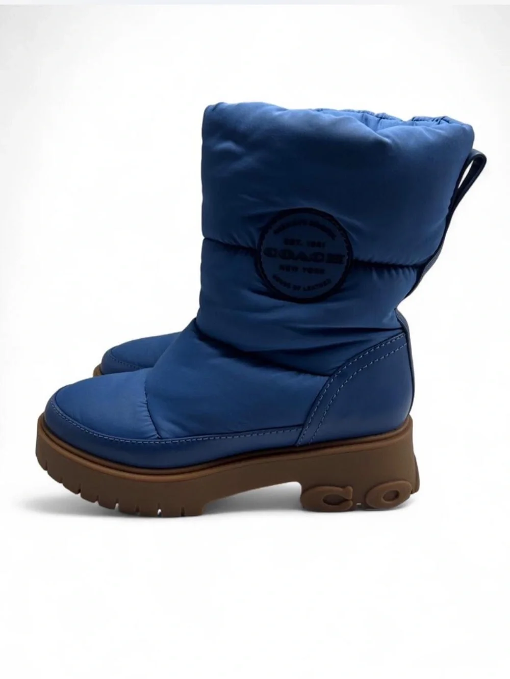 Coach Rya Boots inSky Blue. Quilted puffer-style nylon, leather upper.